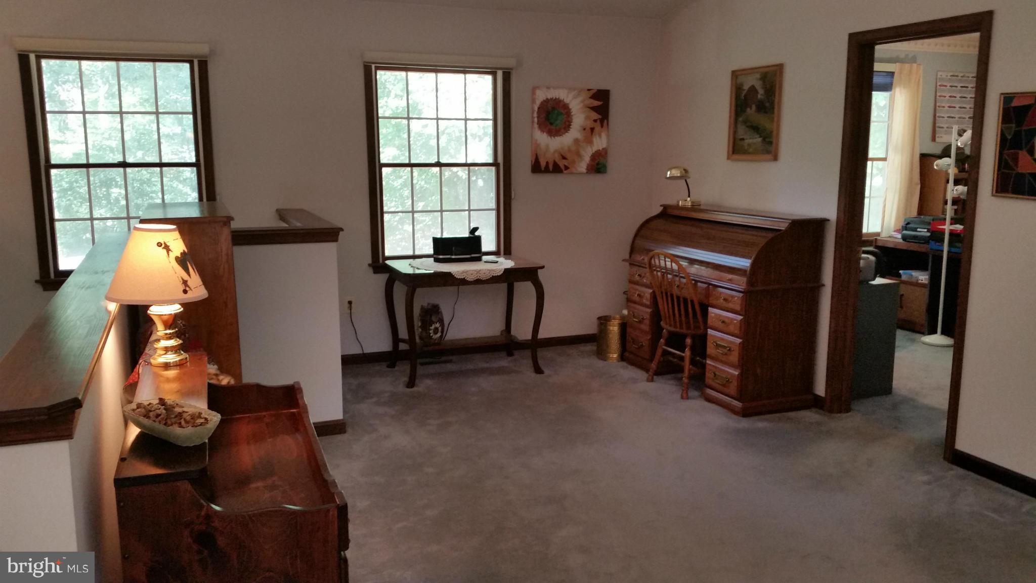11030 Mill Bridge Road Lusby, MD 20657 - Photo 12 of 30 a room with furniture and a window