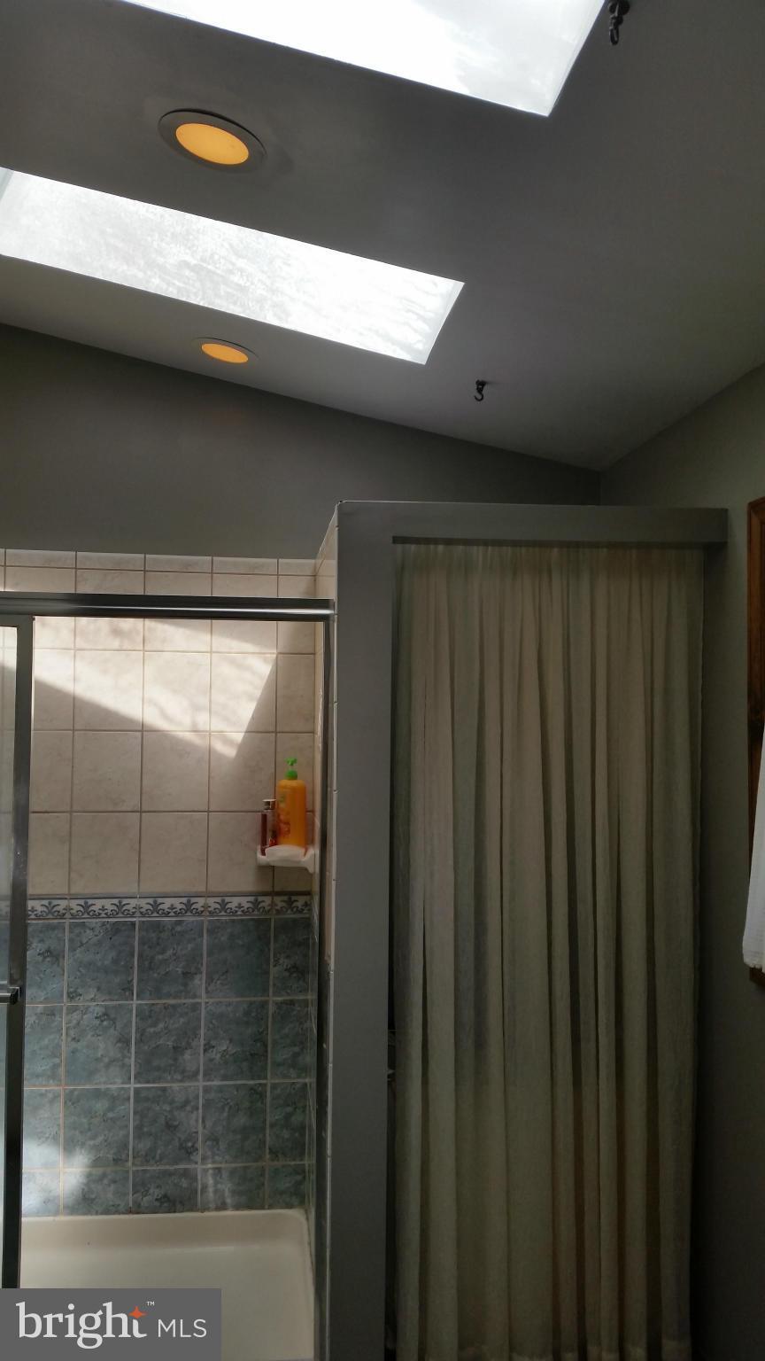 11030 Mill Bridge Road Lusby, MD 20657 - Photo 15 of 30 a bathroom with a shower