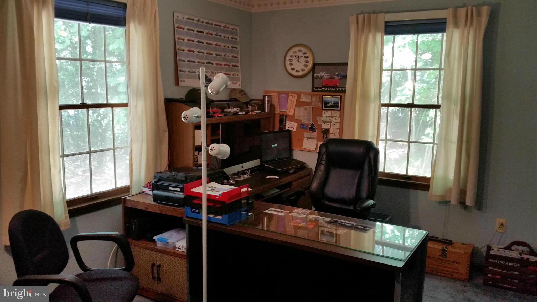 11030 Mill Bridge Road Lusby, MD 20657 - Photo 21 of 30 a room with furniture and a window