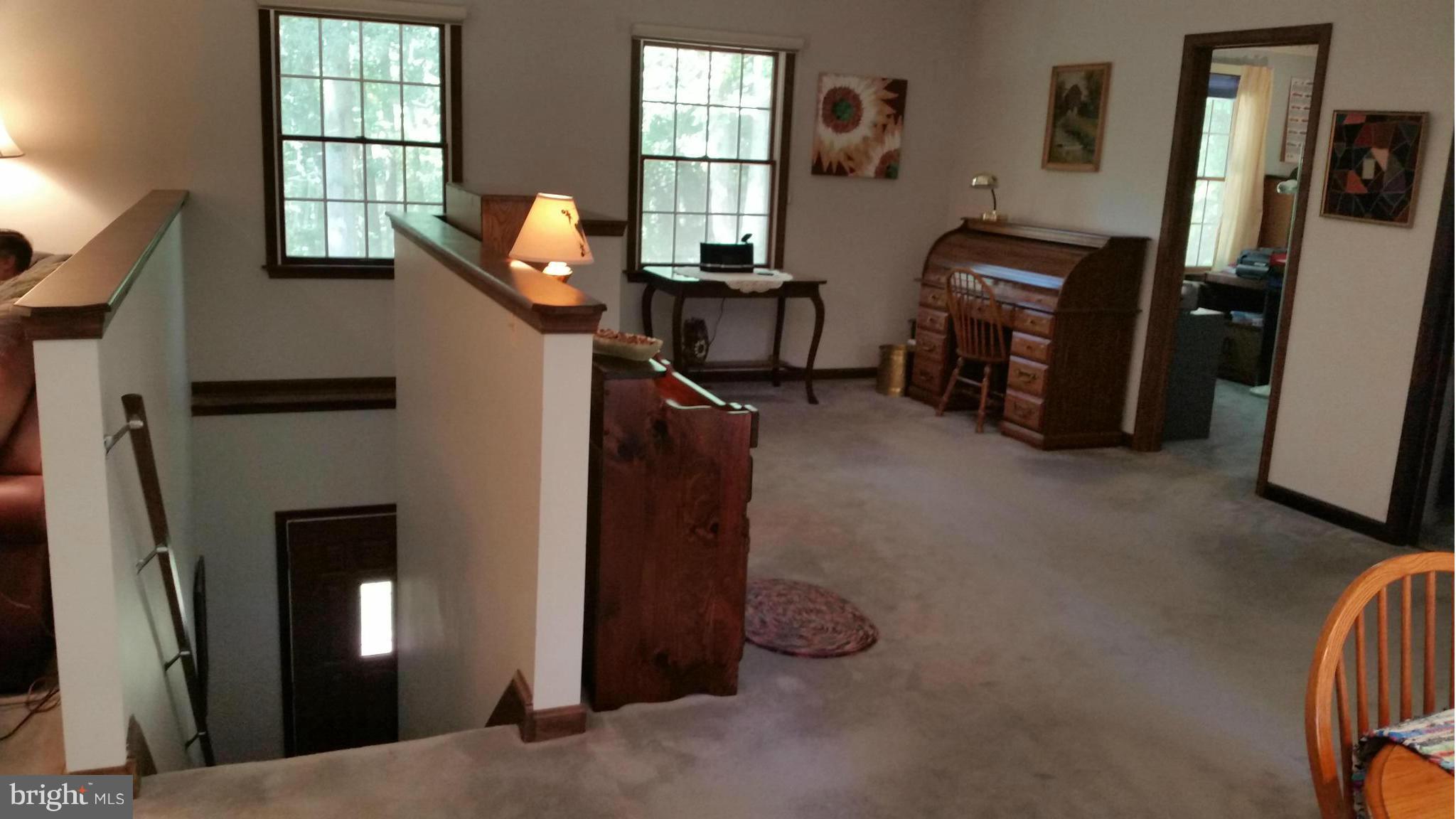 11030 Mill Bridge Road Lusby, MD 20657 - Photo 22 of 30 a room with furniture and window
