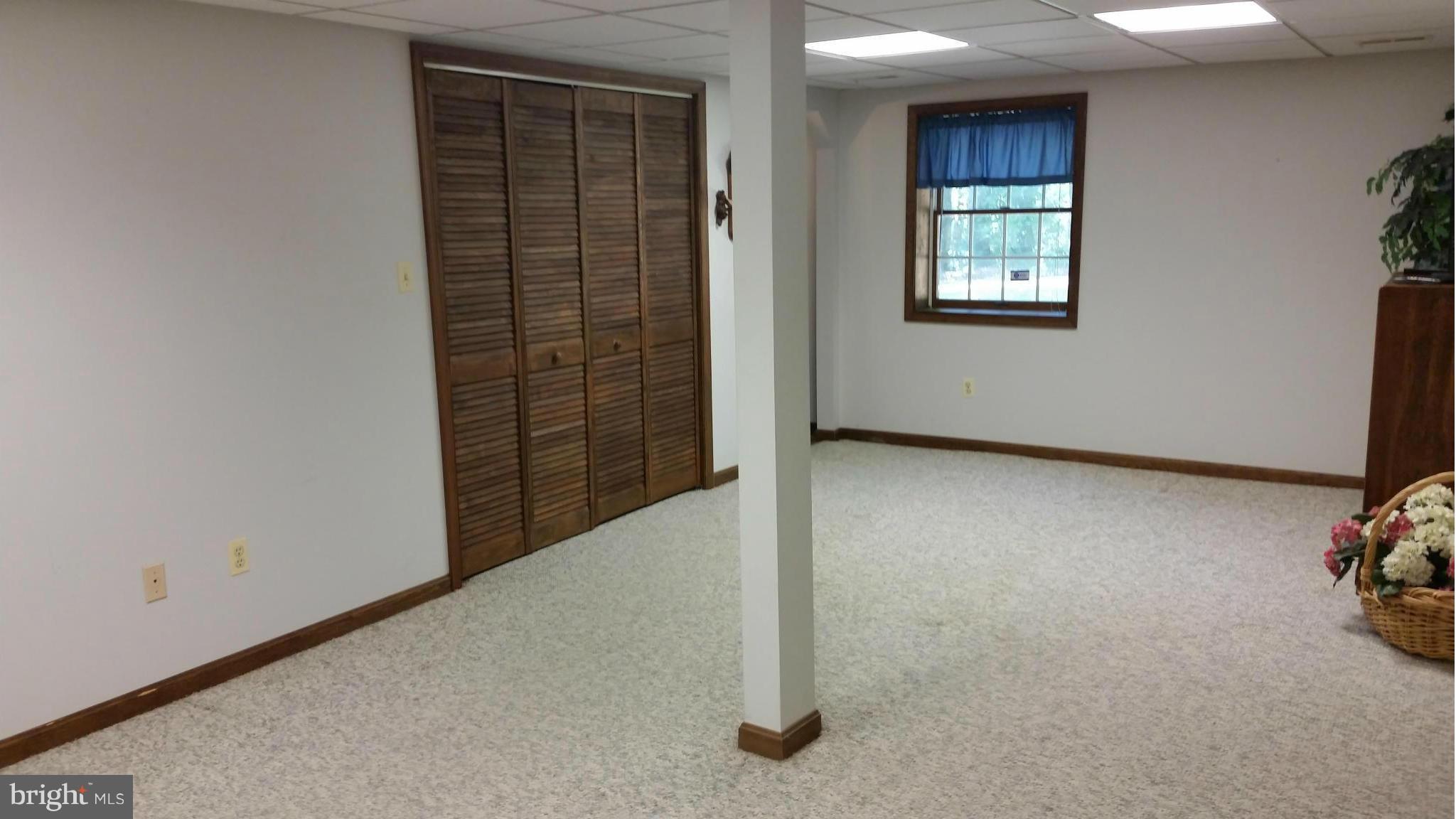 11030 Mill Bridge Road Lusby, MD 20657 - Photo 25 of 30 an empty room with windows