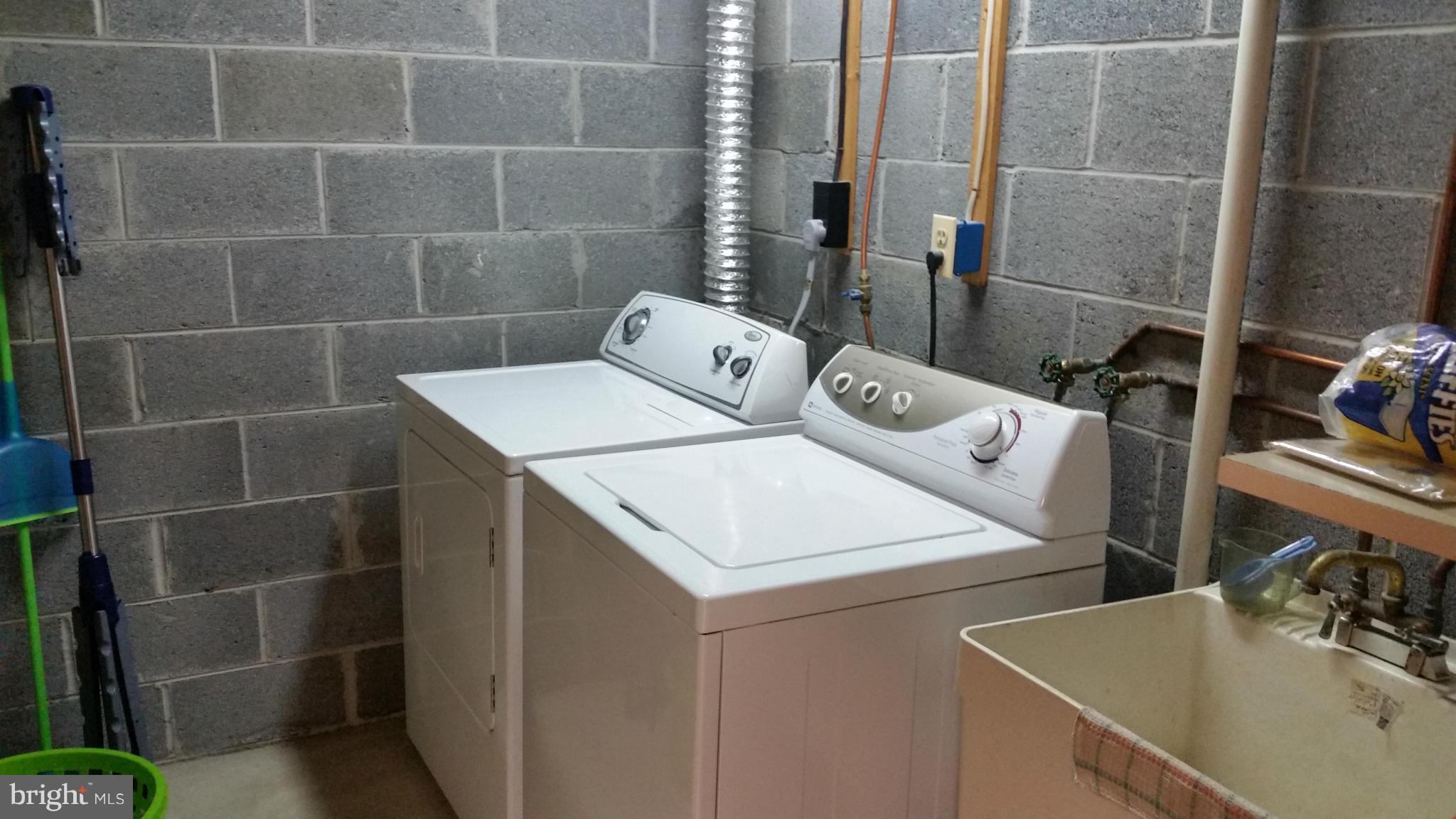 11030 Mill Bridge Road Lusby, MD 20657 - Photo 28 of 30 a bathroom with a sink toilet and shower