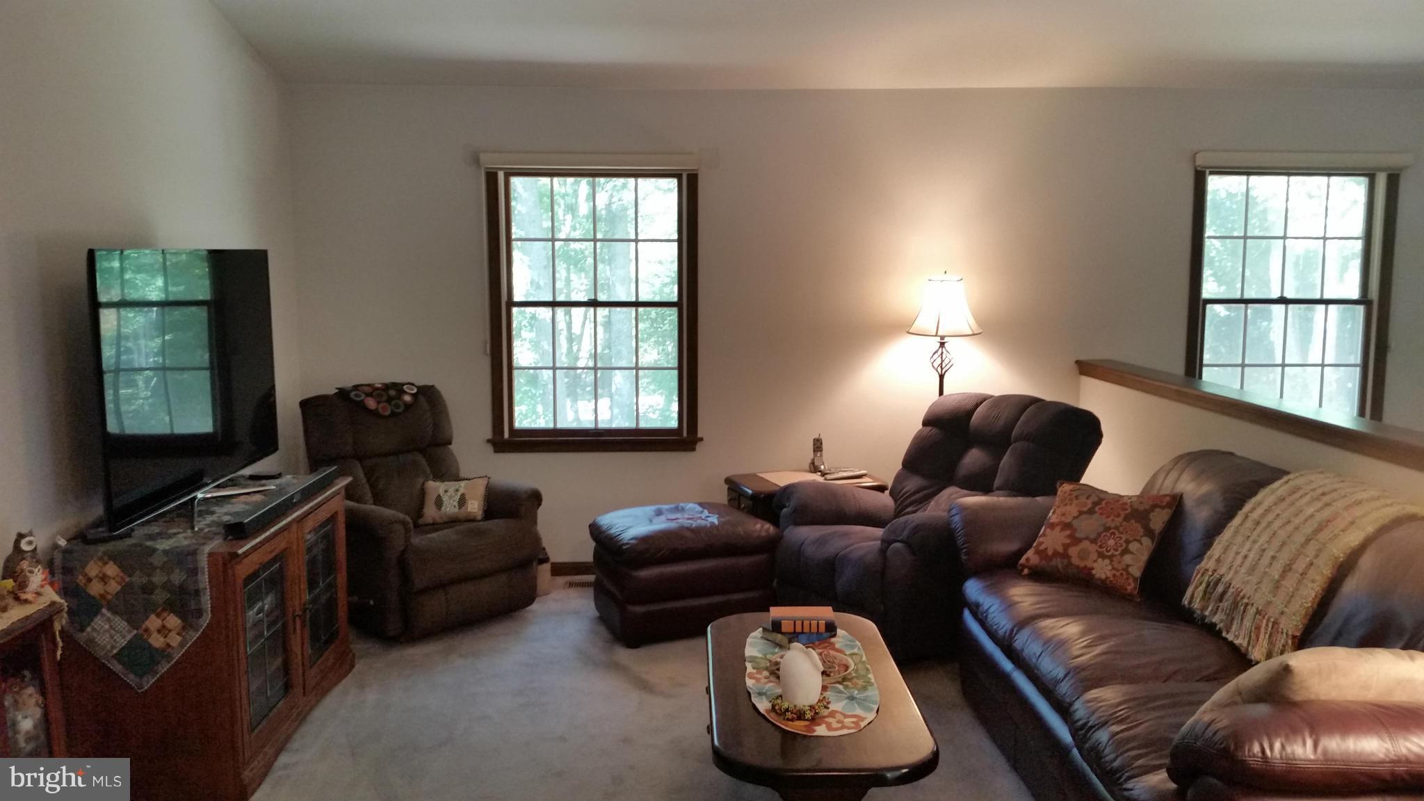 11030 Mill Bridge Road Lusby, MD 20657 - Photo 10 of 30 a living room with furniture and a window