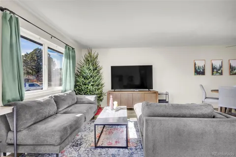 a living room with furniture and a couch