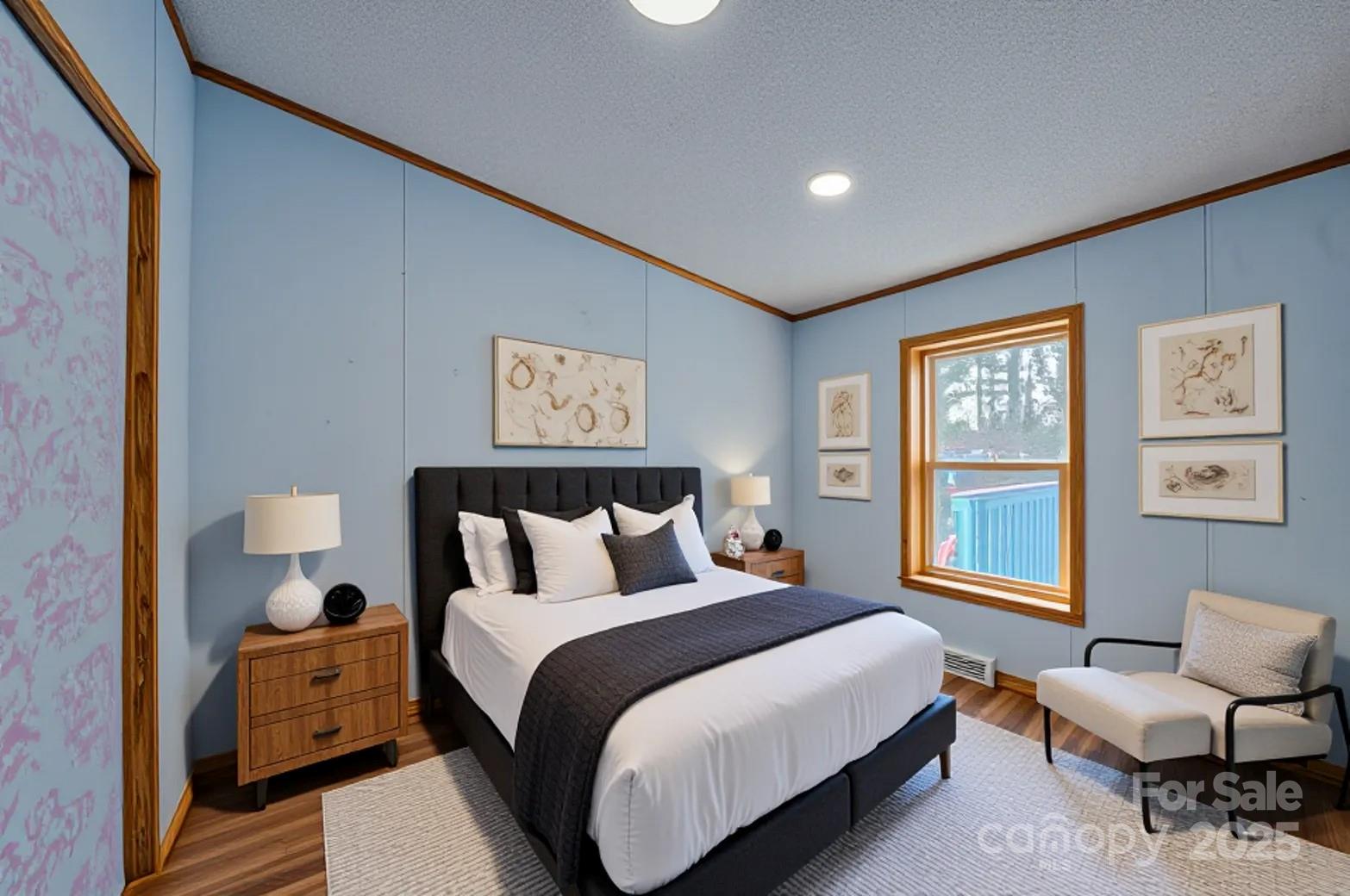 319 Sunrise Ridge Drive, Unit 19 Hendersonville, NC 28792 - Photo 12 of 30 a bedroom with a bed and wooden floor