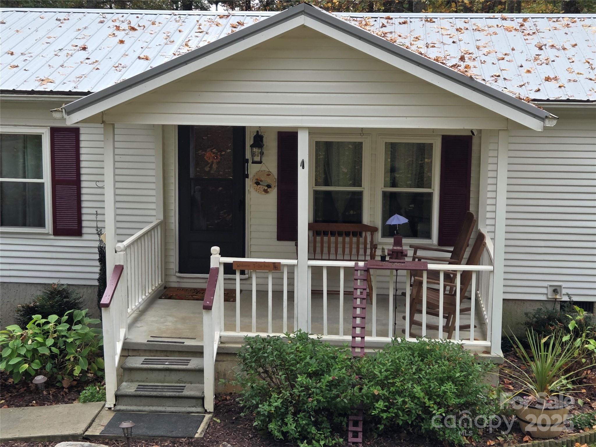 319 Sunrise Ridge Drive, Unit 19 Hendersonville, NC 28792 - Photo 2 of 30 a view of a house with entryway and stairs