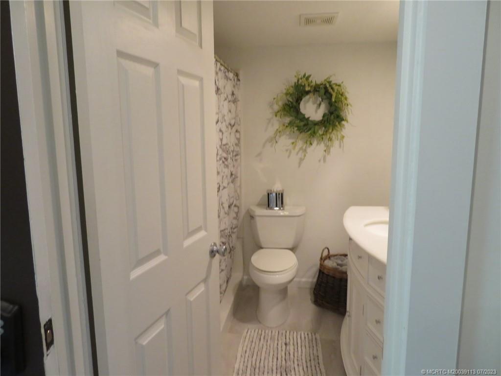 800 Northwest Fork Road, Unit 4 Stuart, FL 34994 - Photo 12 of 31 a bathroom with a toilet and a shower