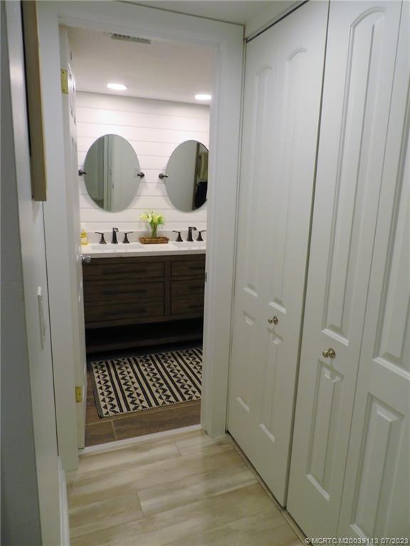 800 Northwest Fork Road, Unit 4 Stuart, FL 34994 - Photo 18 of 31 a bathroom with a mirror and a sink