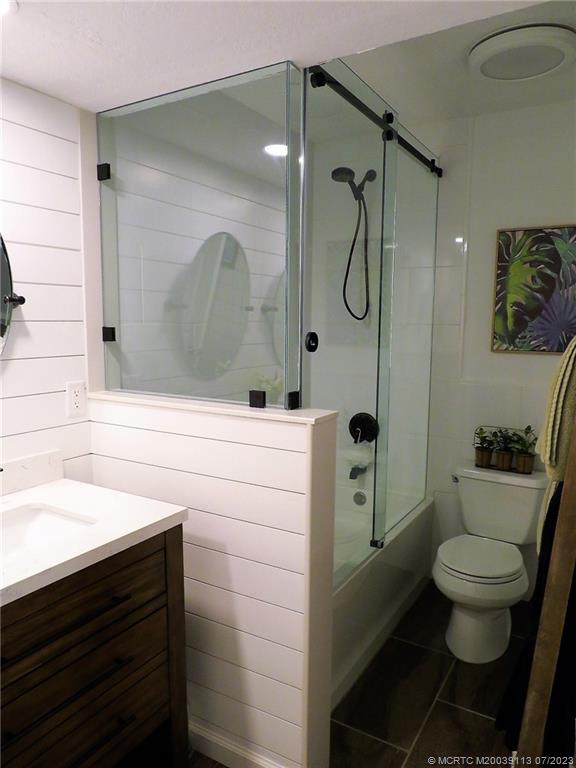 800 Northwest Fork Road, Unit 4 Stuart, FL 34994 - Photo 21 of 31 a bathroom with a sink a toilet and shower