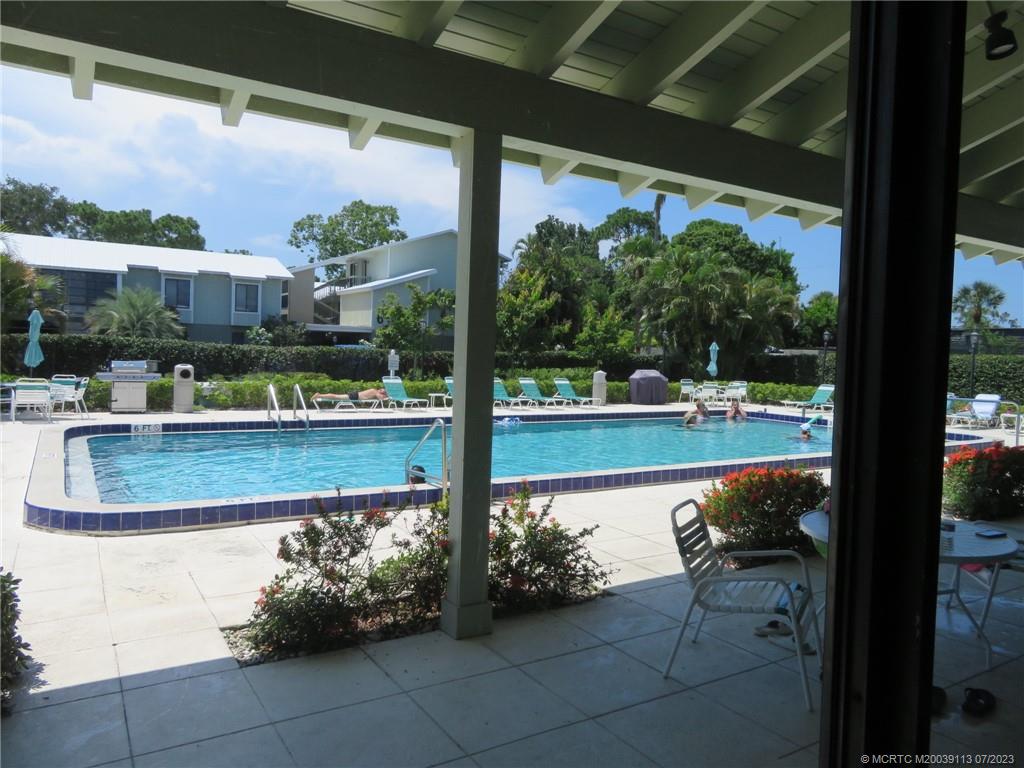800 Northwest Fork Road, Unit 4 Stuart, FL 34994 - Photo 26 of 31 a view of swimming pool with a patio