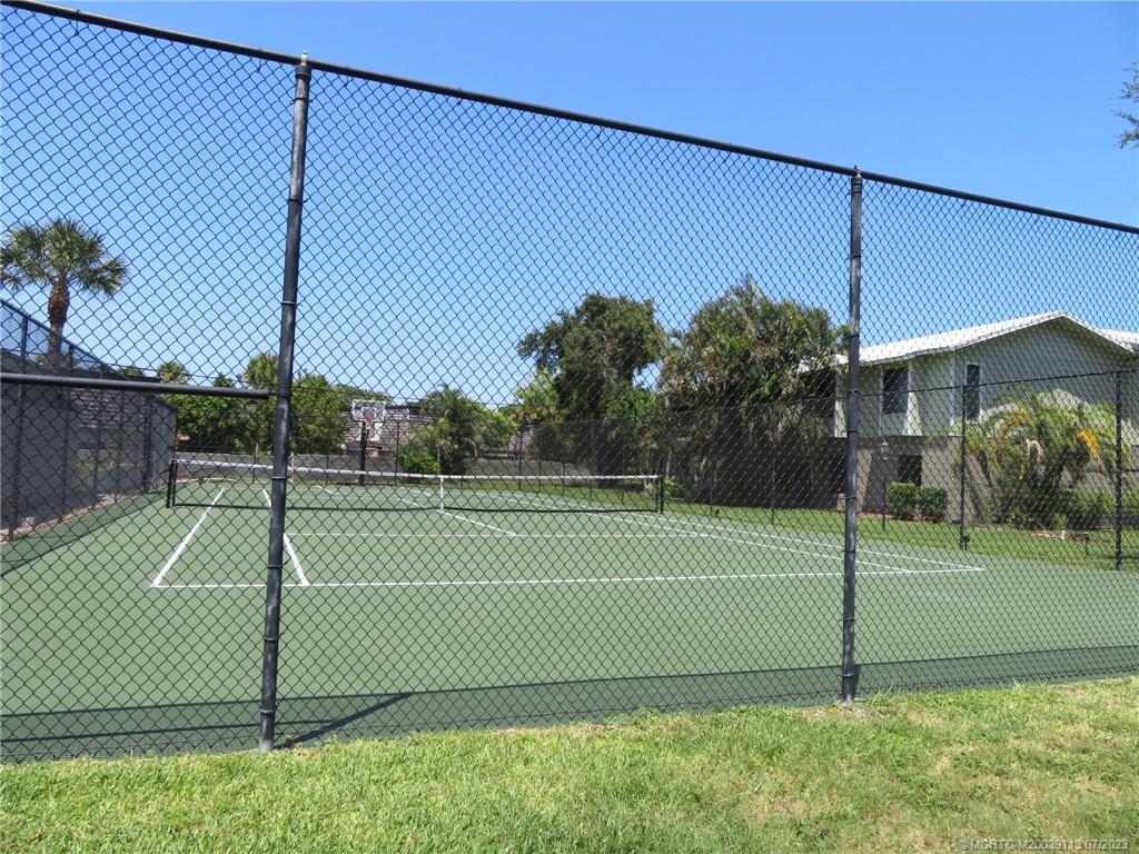800 Northwest Fork Road, Unit 4 Stuart, FL 34994 - Photo 28 of 31 a view of a tennis court
