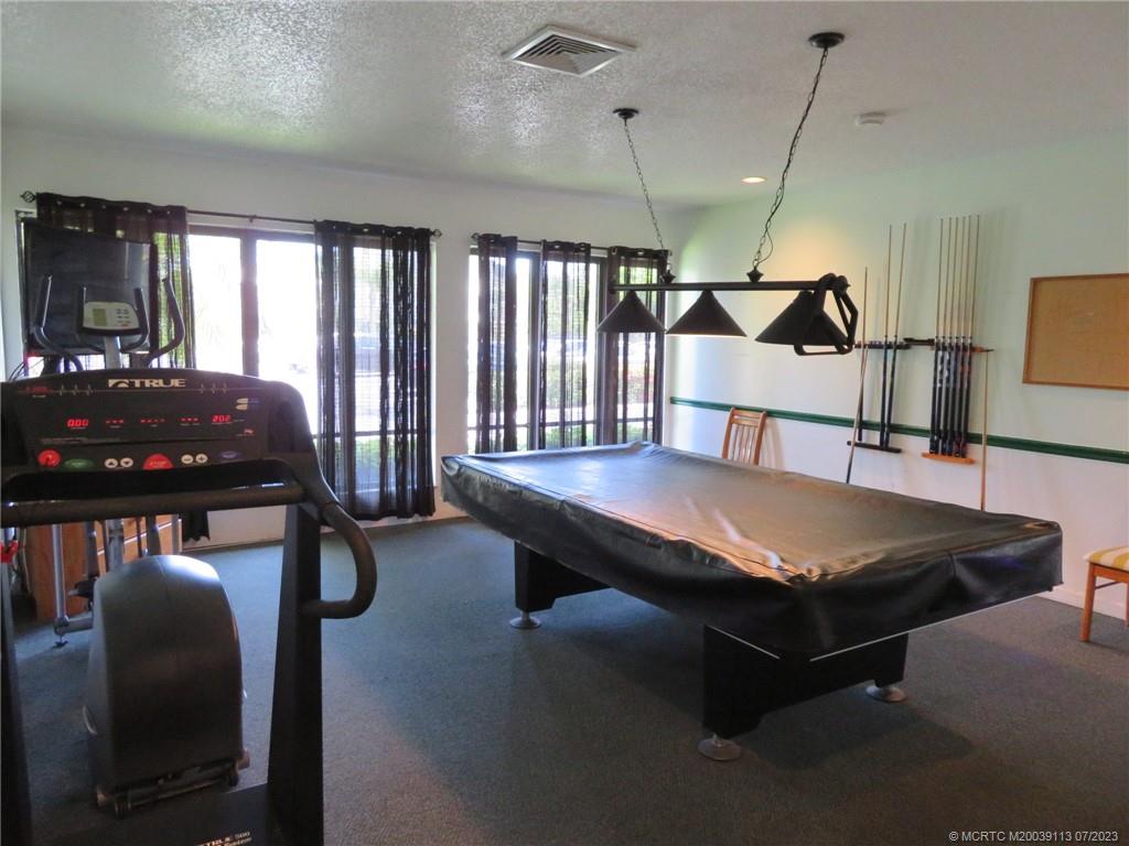 800 Northwest Fork Road, Unit 4 Stuart, FL 34994 - Photo 31 of 31 a room with furniture pool table and windows