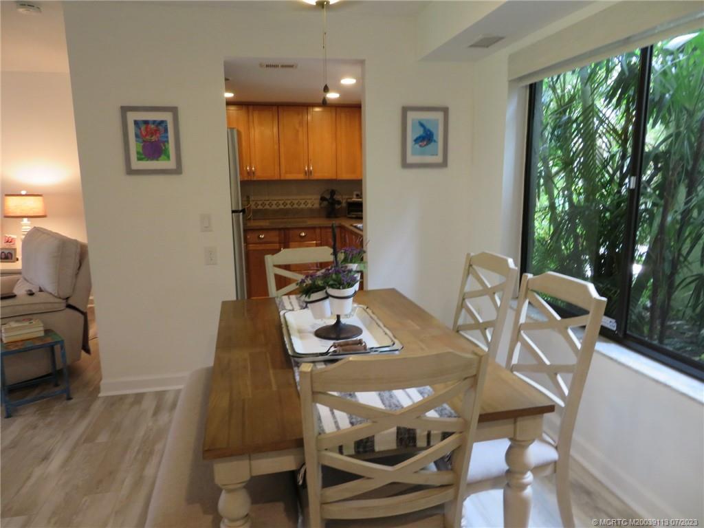 800 Northwest Fork Road, Unit 4 Stuart, FL 34994 - Photo 5 of 31 a view of a dining room with furniture window and outside view