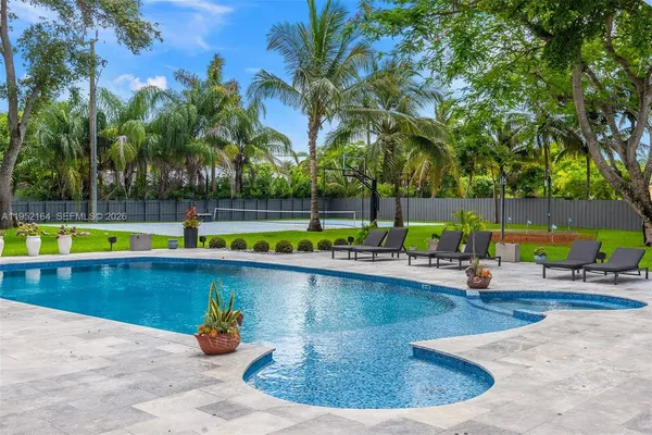 a view of swimming pool with outdoor seating