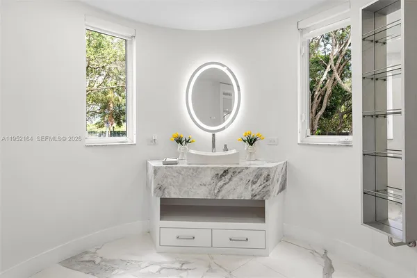 a bathroom with a sink and a mirror