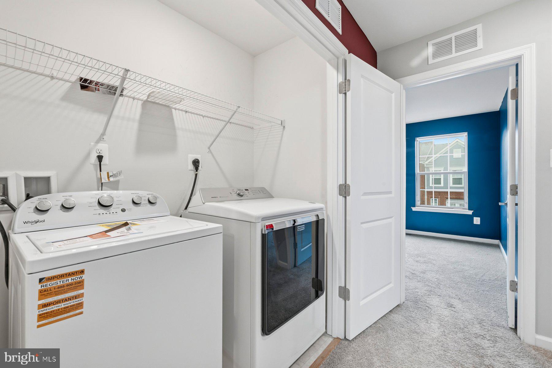 2917 Duvall Ridge Road, Unit 559 Hyattsville, MD 20785 - Photo 22 of 31 a utility room with dryer and washer