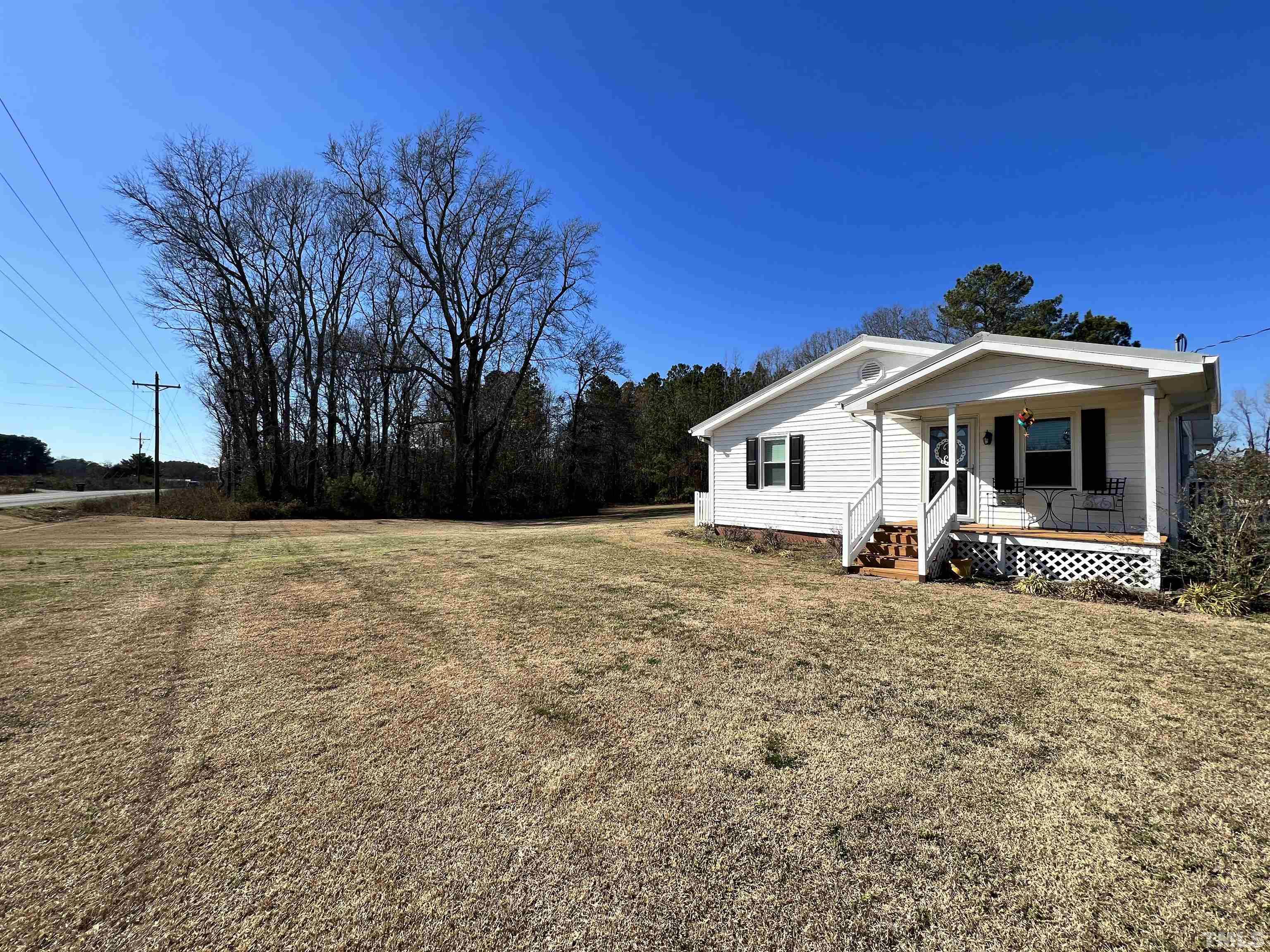 2929 Wall Store Road, Unit 0WALL STORE ROAD Garner, NC 27529 - Photo 4 of 16 a front view of a house with a yard