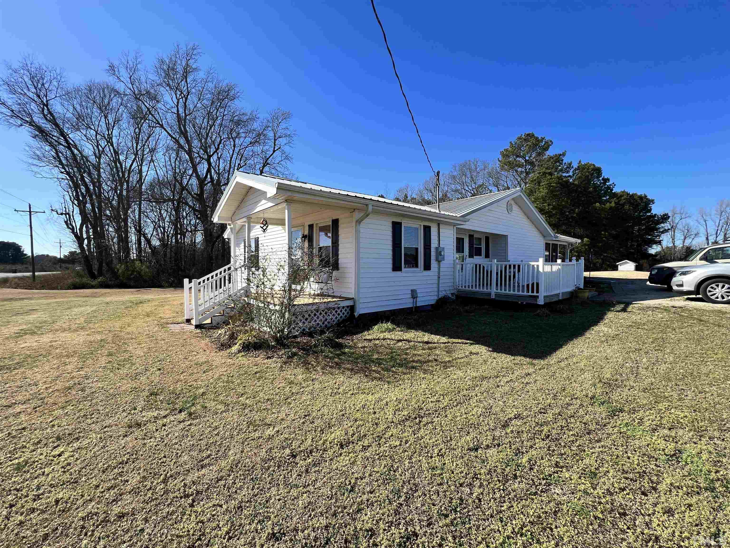 2929 Wall Store Road, Unit 0WALL STORE ROAD Garner, NC 27529 - Photo 5 of 16 a view of a house with a yard covered in snow