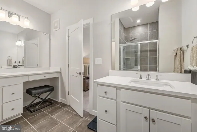 a bathroom with a sink double vanity and a mirror
