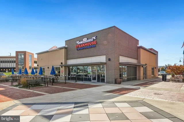 a sign board on the side of a street