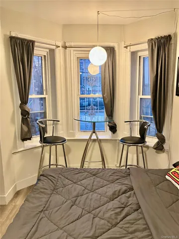 a view of two chairs and a wooden floor