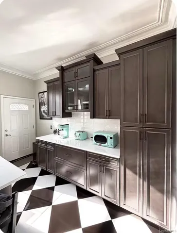 a kitchen with stainless steel appliances kitchen island granite countertop a sink and cabinets