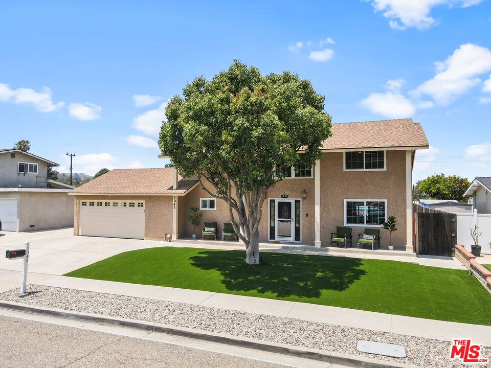 1043 Appleton Road Simi Valley, CA 93065 - Photo 1 of 53 a front view of a house with a yard and garage