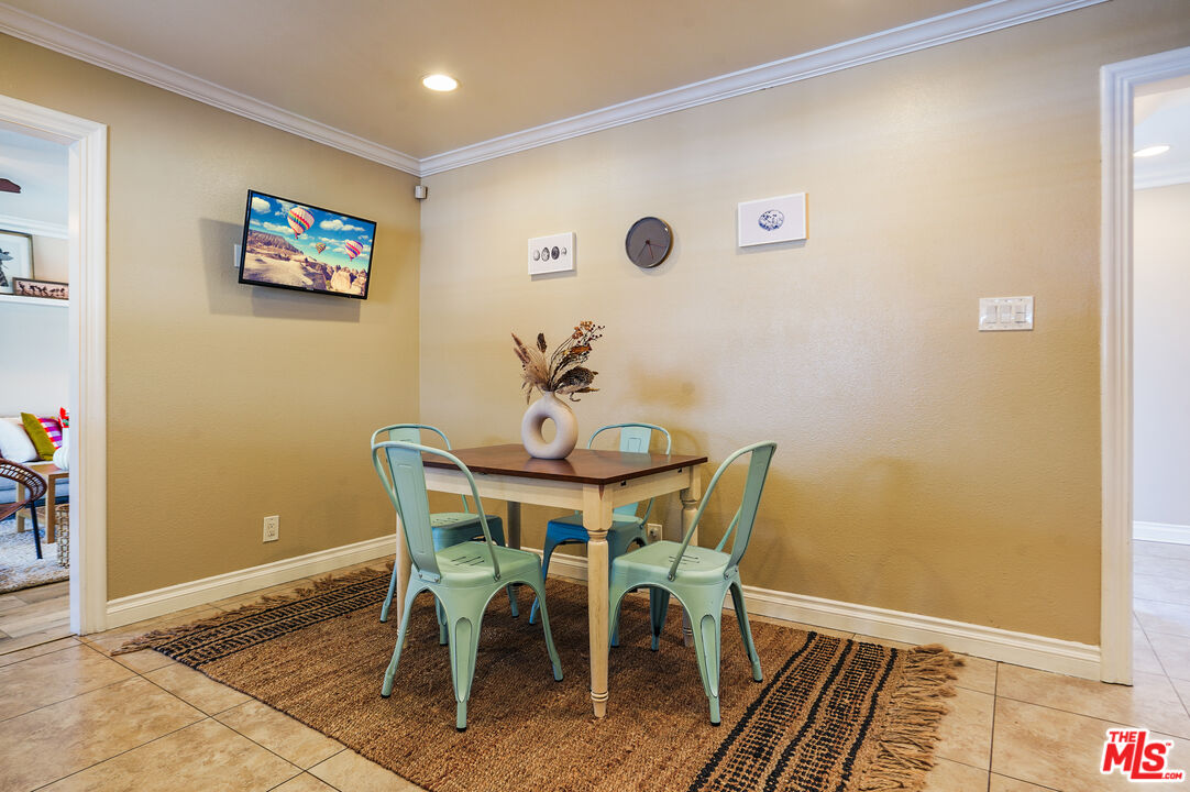 1043 Appleton Road Simi Valley, CA 93065 - Photo 13 of 53 a view of a dining room with furniture and wooden floor