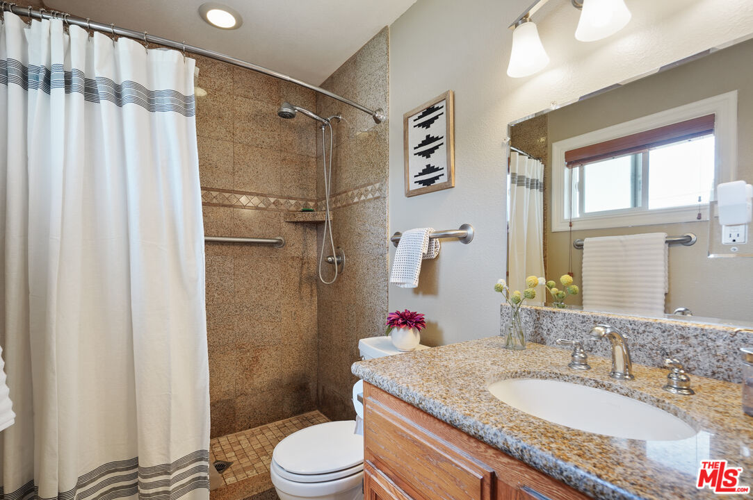 1043 Appleton Road Simi Valley, CA 93065 - Photo 14 of 53 a bathroom with a granite countertop sink toilet and shower