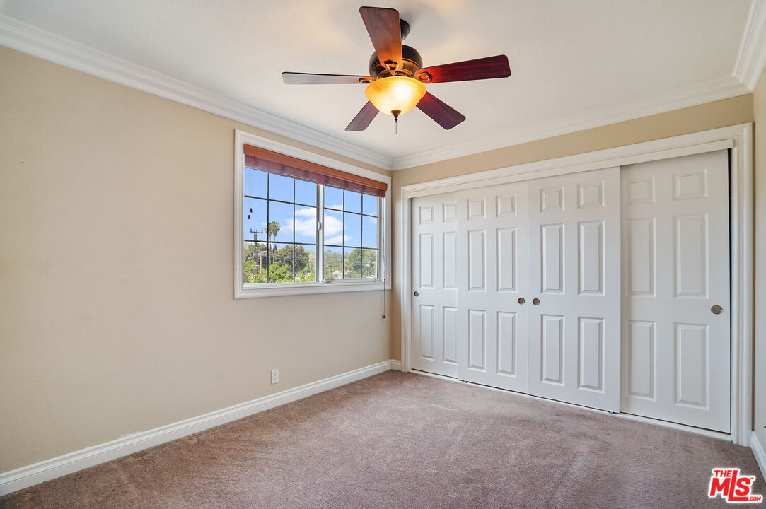 1043 Appleton Road Simi Valley, CA 93065 - Photo 19 of 53 a view of an entryway with a chandelier fan