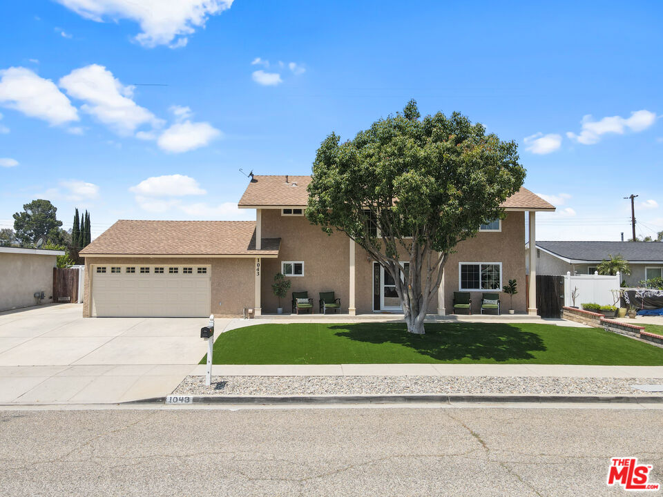 1043 Appleton Road Simi Valley, CA 93065 - Photo 2 of 53 a front view of a house with a yard and garage