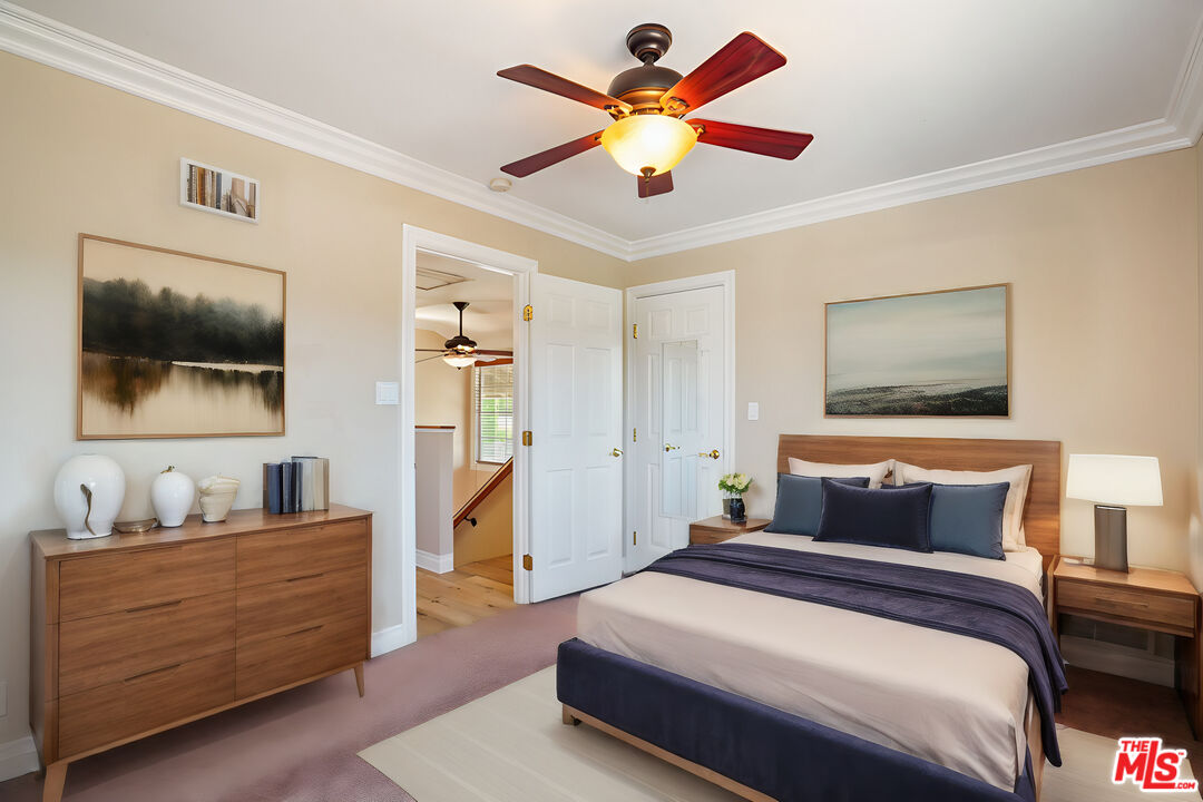 1043 Appleton Road Simi Valley, CA 93065 - Photo 21 of 53 a bedroom with a large bed and a flat screen tv