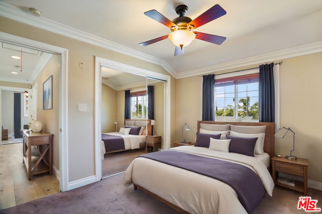 1043 Appleton Road Simi Valley, CA 93065 - Photo 27 of 53 a bedroom with a large bed and a chandelier