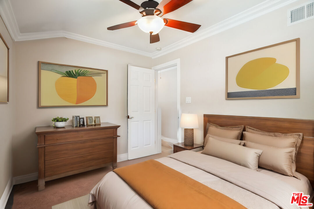 1043 Appleton Road Simi Valley, CA 93065 - Photo 30 of 53 a bedroom with a bed and a cabinets