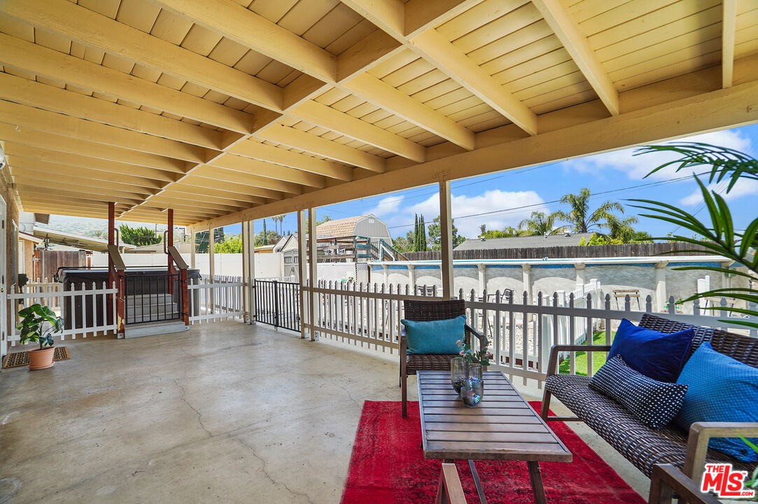 1043 Appleton Road Simi Valley, CA 93065 - Photo 32 of 53 a view of a patio with a table and chairs