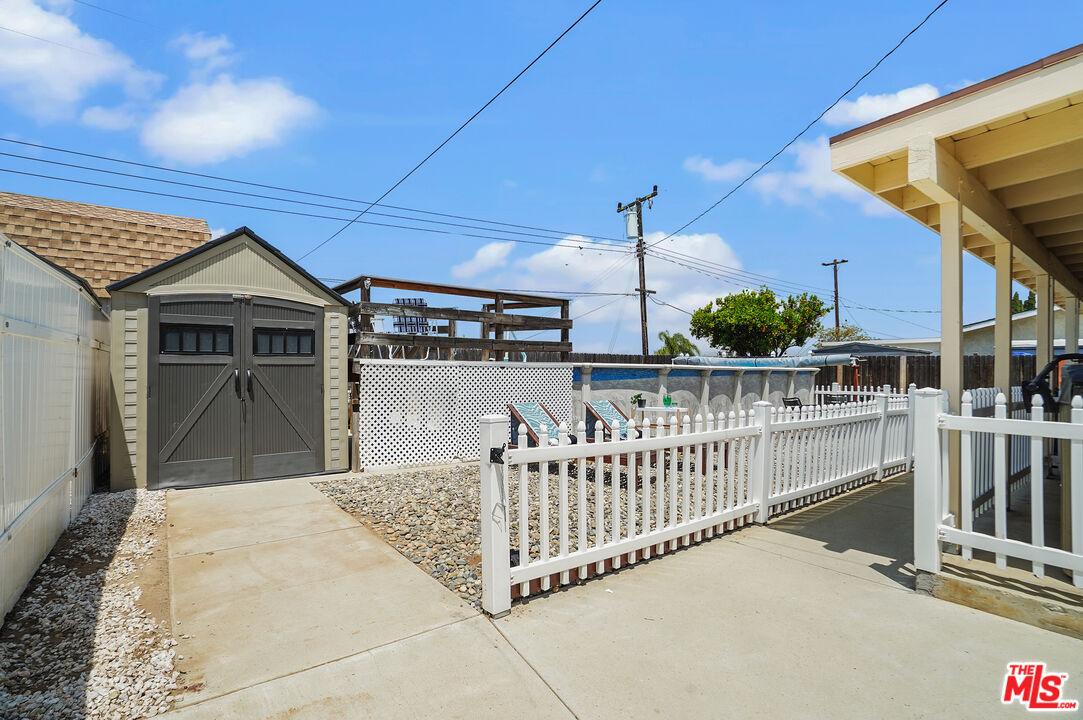 1043 Appleton Road Simi Valley, CA 93065 - Photo 34 of 53 a view of a house with deck and a yard