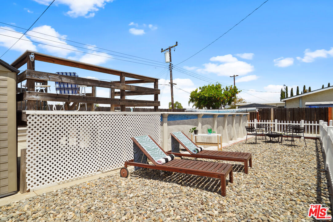 1043 Appleton Road Simi Valley, CA 93065 - Photo 35 of 53 a roof deck with a table and chairs