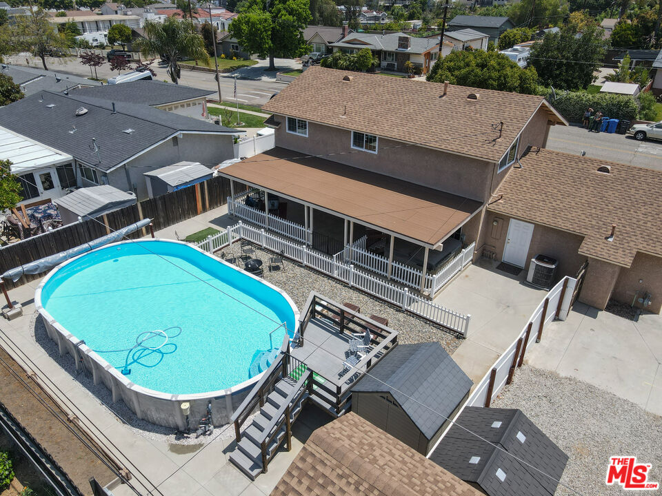 1043 Appleton Road Simi Valley, CA 93065 - Photo 48 of 53 an aerial view of a house with a swimming pool and outdoor seating