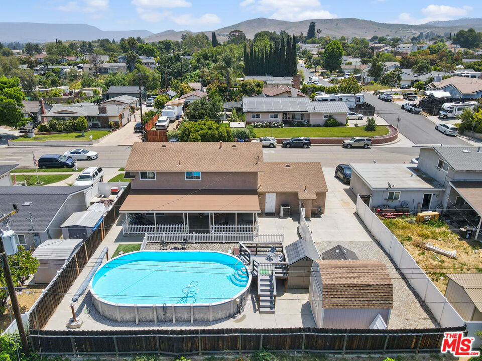 1043 Appleton Road Simi Valley, CA 93065 - Photo 49 of 53 an aerial view of a house with a swimming pool outdoor seating and yard