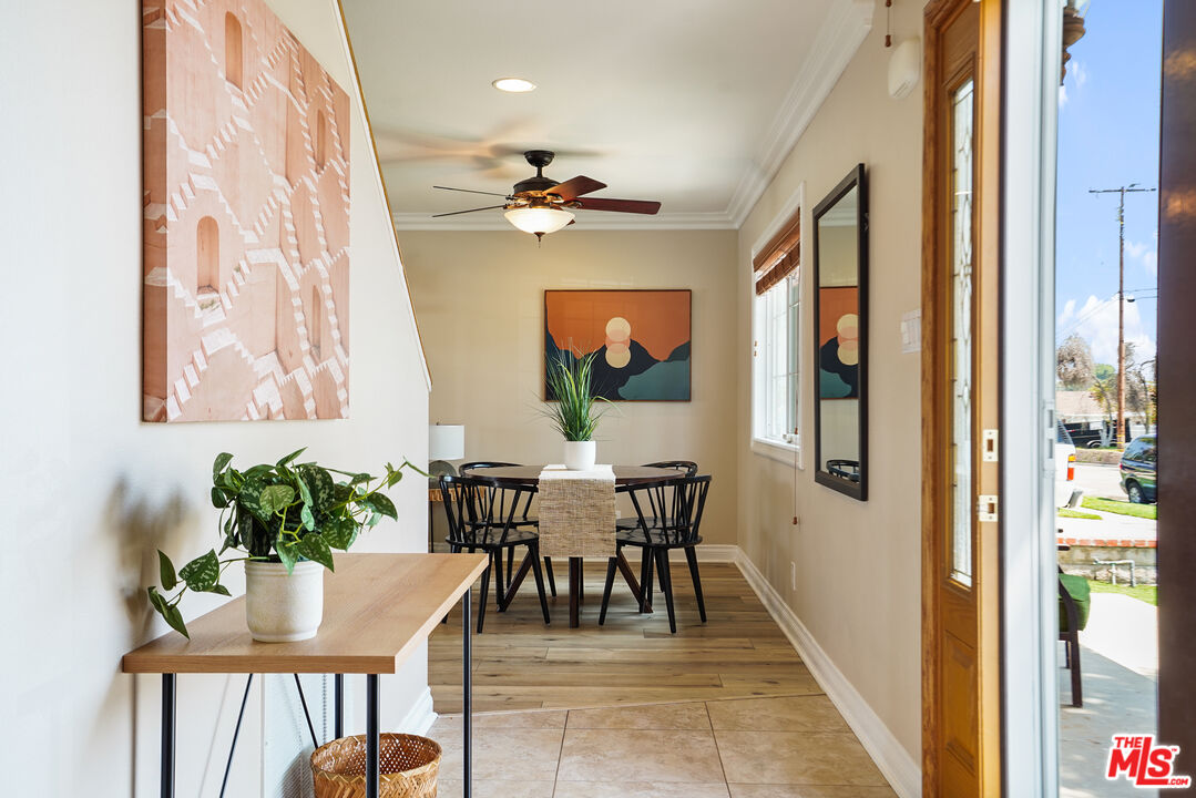 1043 Appleton Road Simi Valley, CA 93065 - Photo 5 of 53 a dining room with furniture potted plants and wooden floor