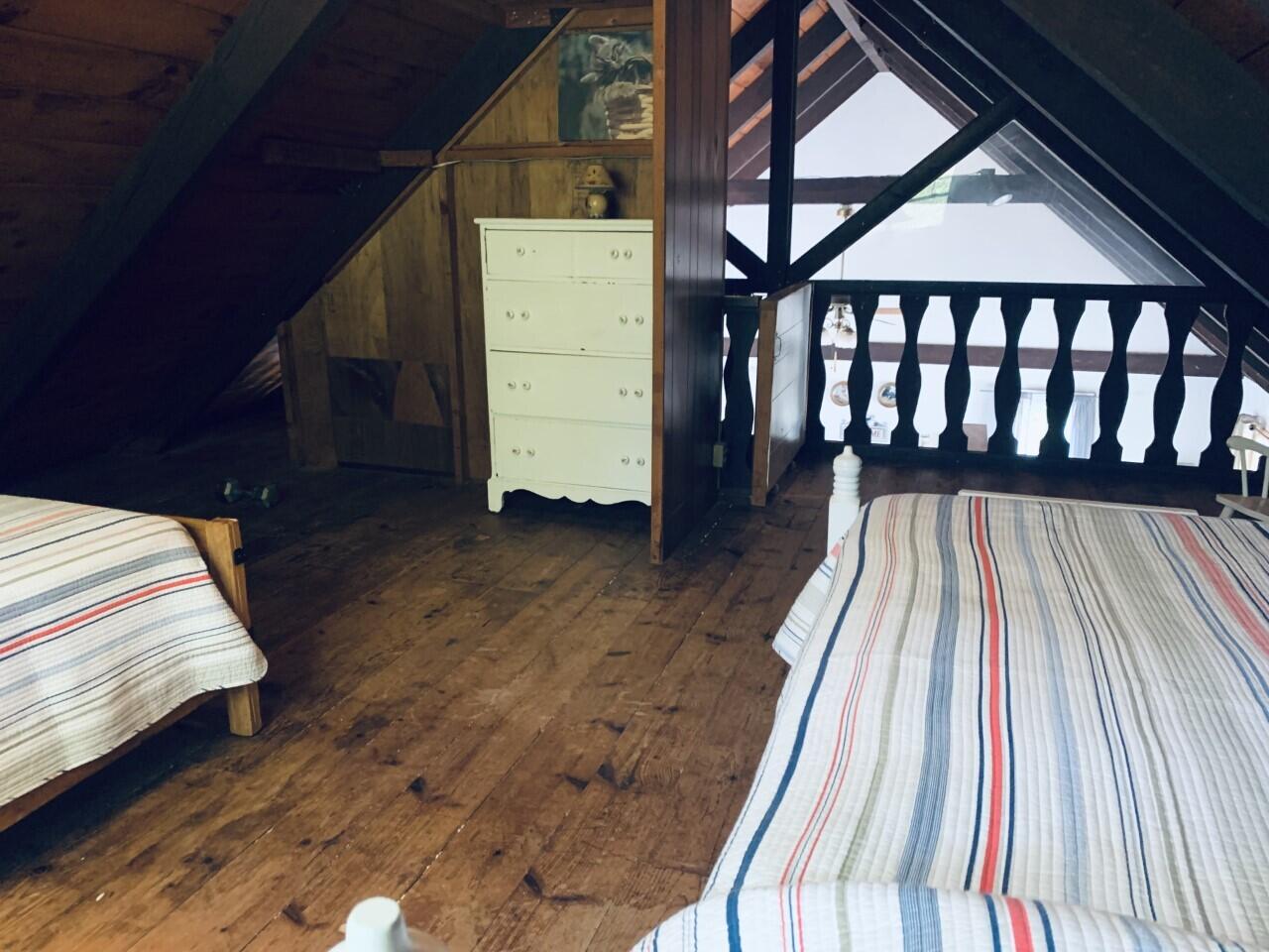 46 Williams Avenue Pocasset, MA 02559 - Photo 13 of 26 a view of a bedroom with wooden floor and staircase