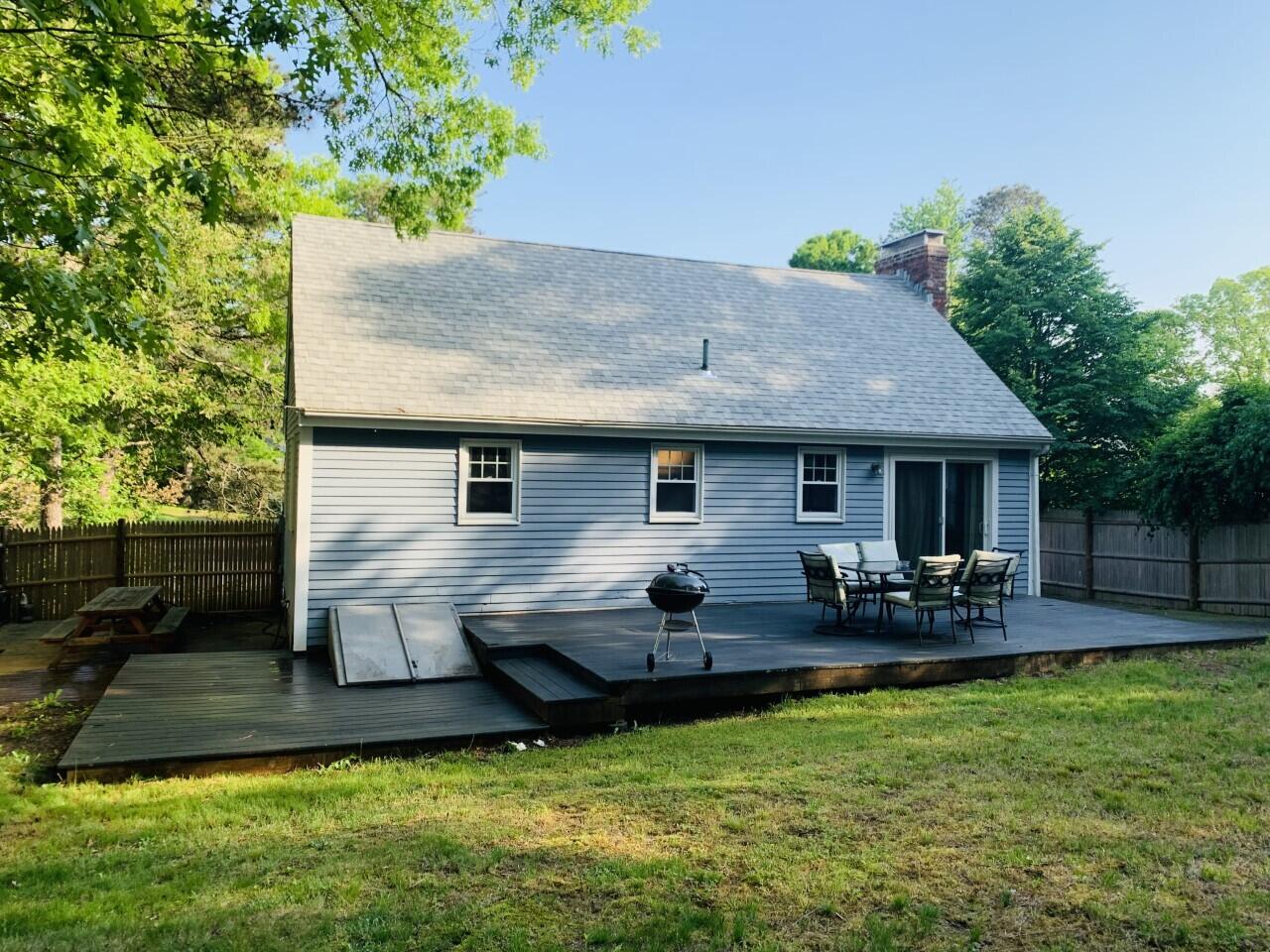 46 Williams Avenue Pocasset, MA 02559 - Photo 2 of 26 a view of a house with a patio