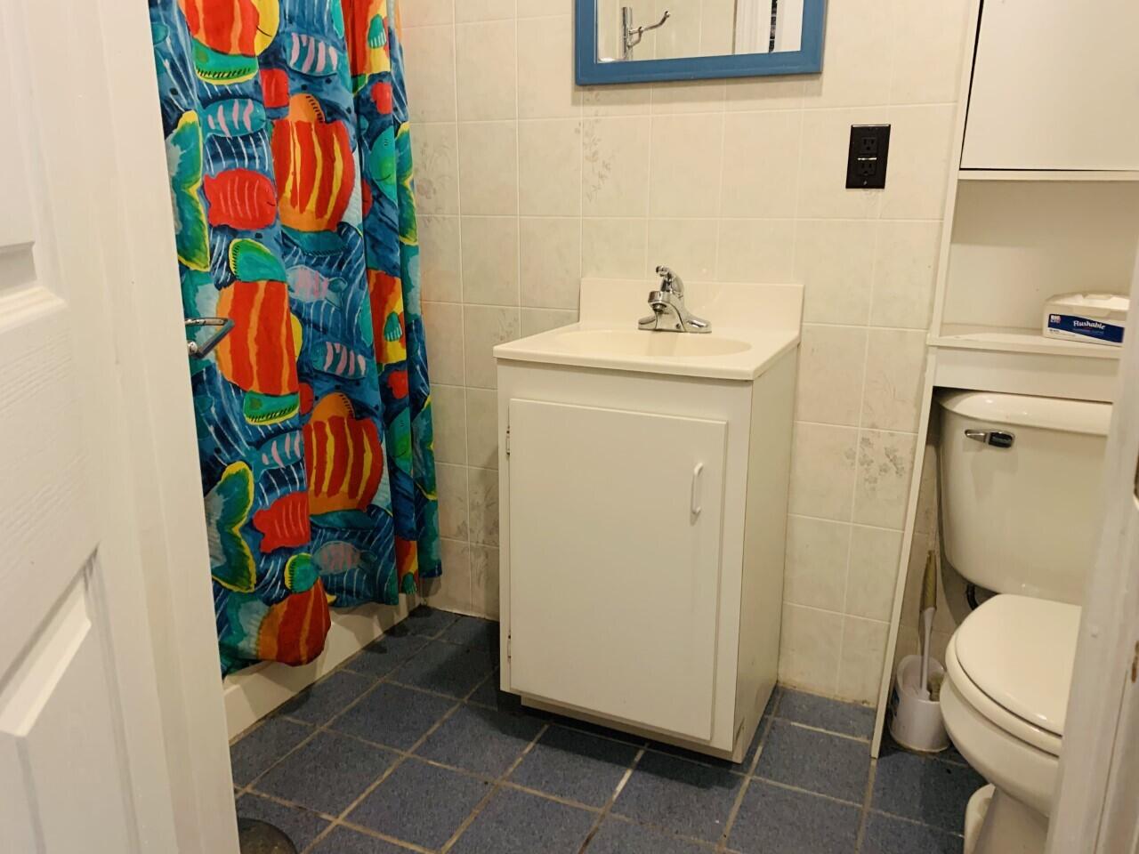 46 Williams Avenue Pocasset, MA 02559 - Photo 22 of 26 a bathroom with a sink mirror vanity and toilet