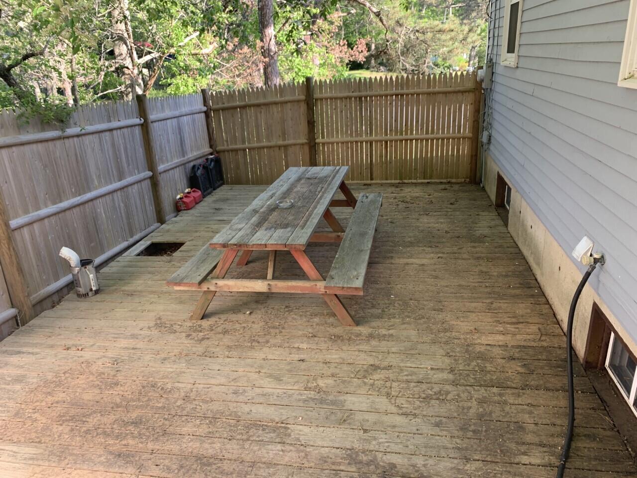 46 Williams Avenue Pocasset, MA 02559 - Photo 26 of 26 a view of a backyard with a small cabin and wooden fence