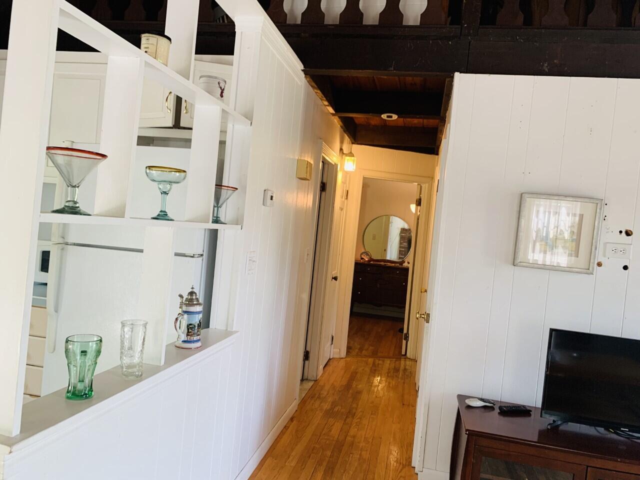 46 Williams Avenue Pocasset, MA 02559 - Photo 6 of 26 a view of a hallway to a livingroom with furniture