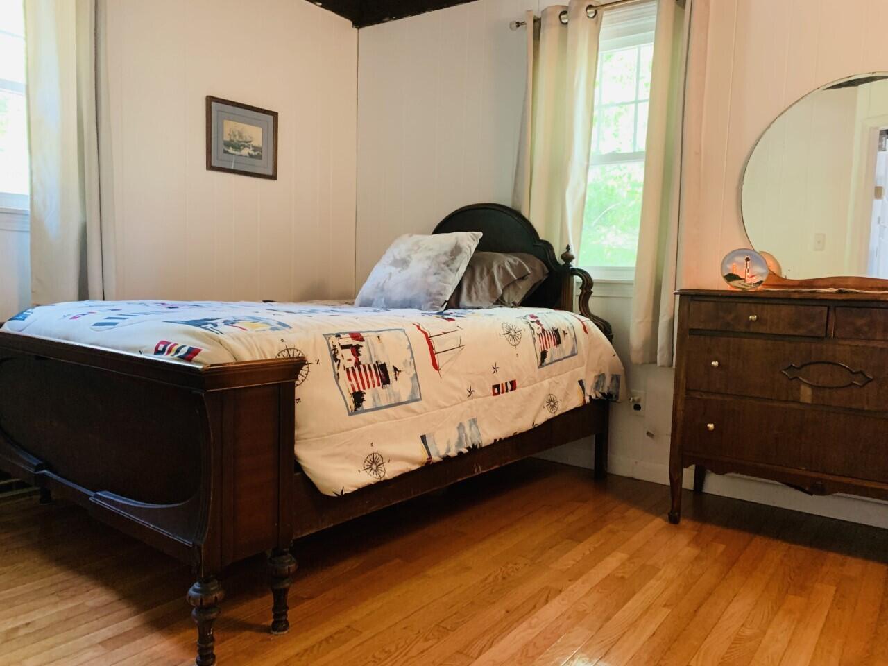 46 Williams Avenue Pocasset, MA 02559 - Photo 8 of 26 a bedroom with a bed and a window