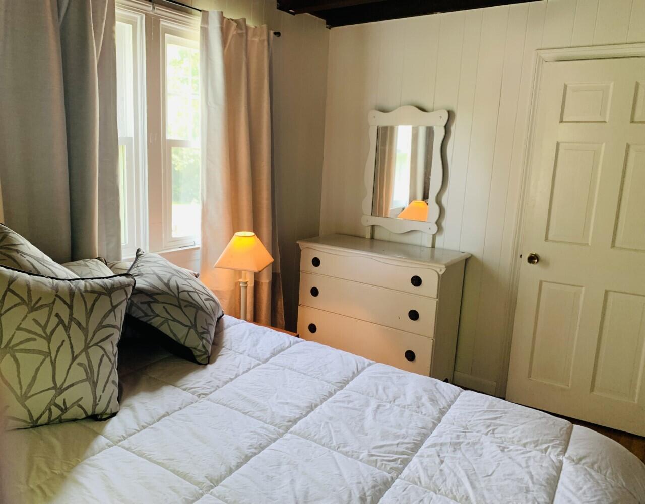46 Williams Avenue Pocasset, MA 02559 - Photo 10 of 26 a bedroom with a bed and window