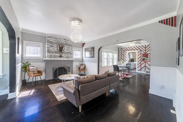 a view of a dining room with furniture and wooden floor