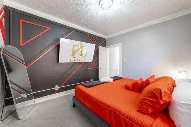 a bedroom with a bed and window