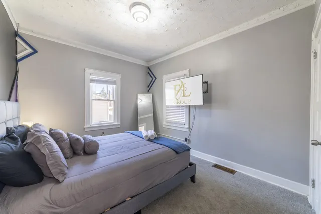 a living room with furniture and large window